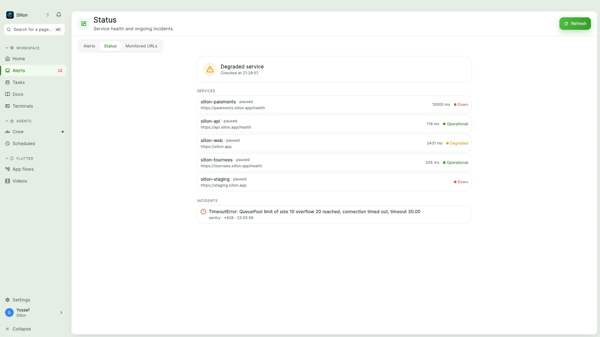 A status page with an outage in progress, five services with response times, one open incident.